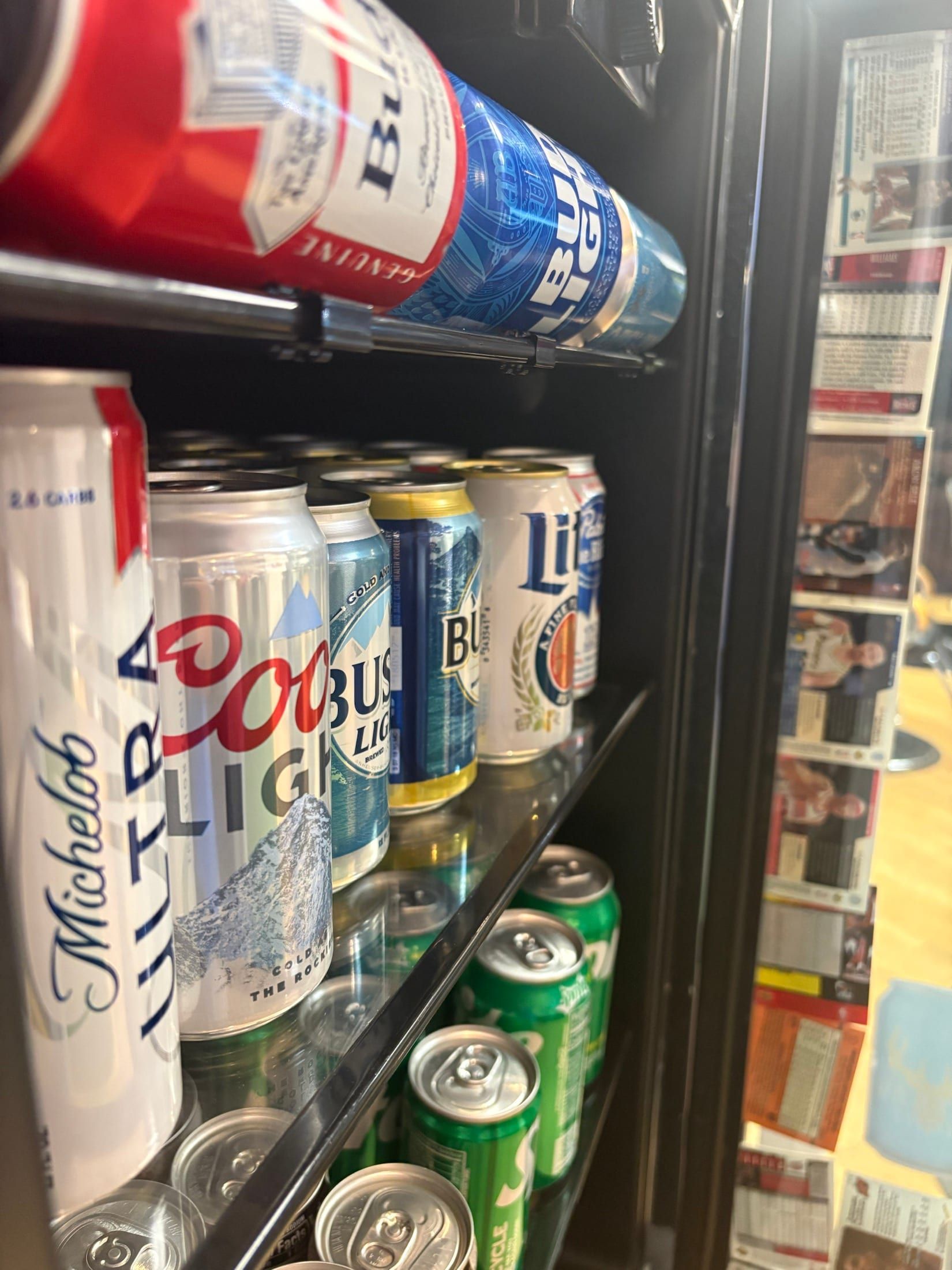 Cold beer and soft drinks stocked in the Fantasy Sports Cuts sports lounge fridge