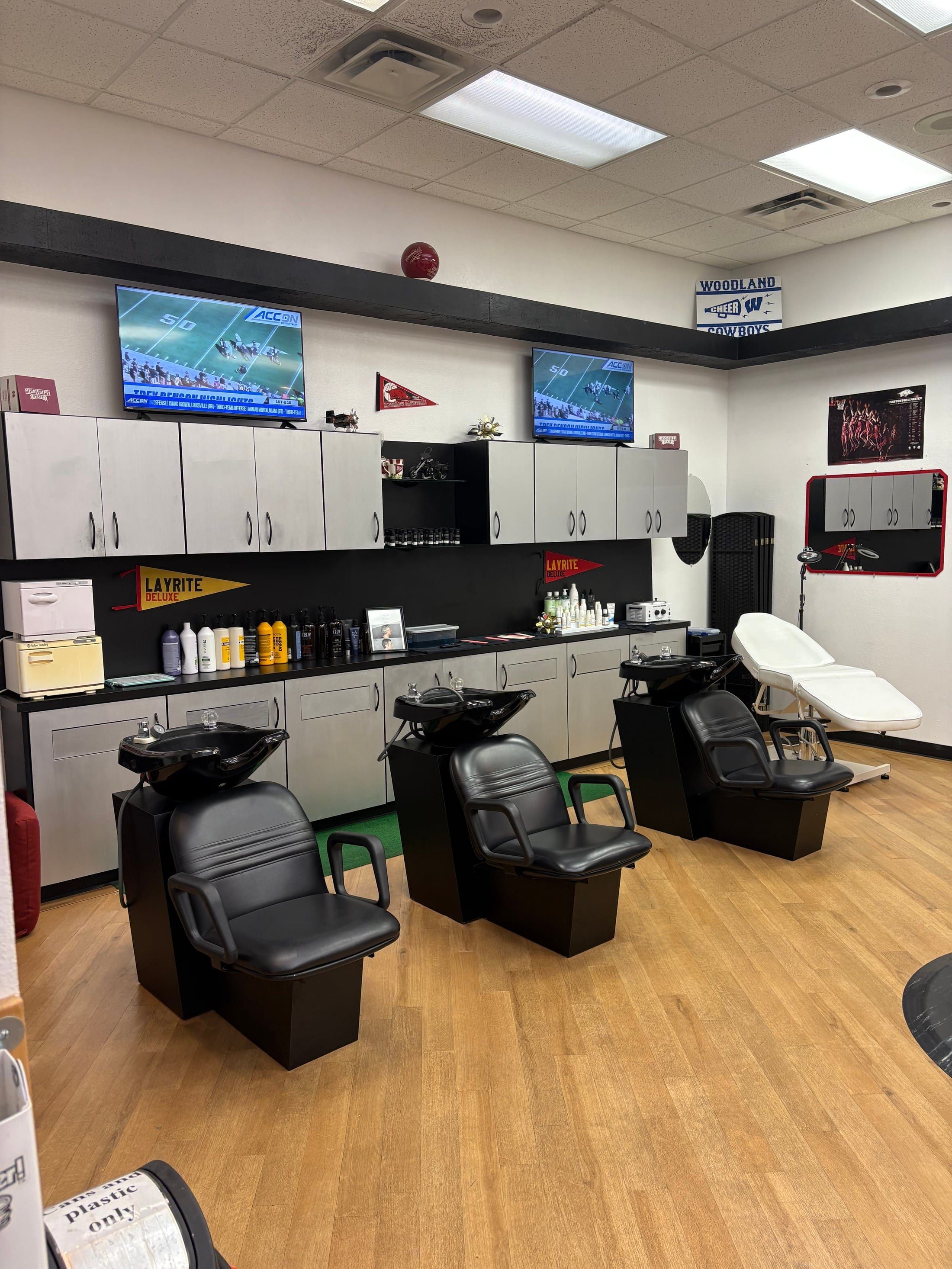 Fantasy Sports Cuts shampoo bar with TVs and wash stations in Fayetteville AR